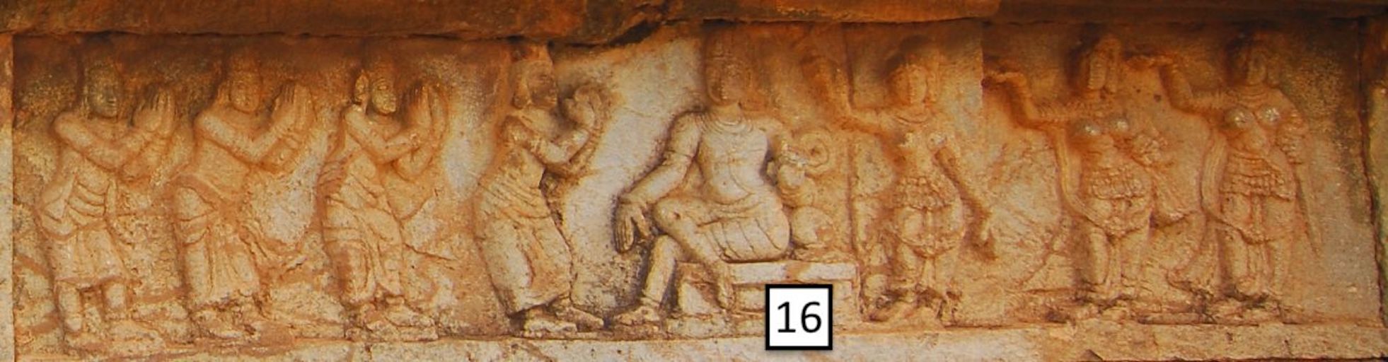 Mahanabami Dibba - detail of King's audience stone frieze with seated central figure and standing figures