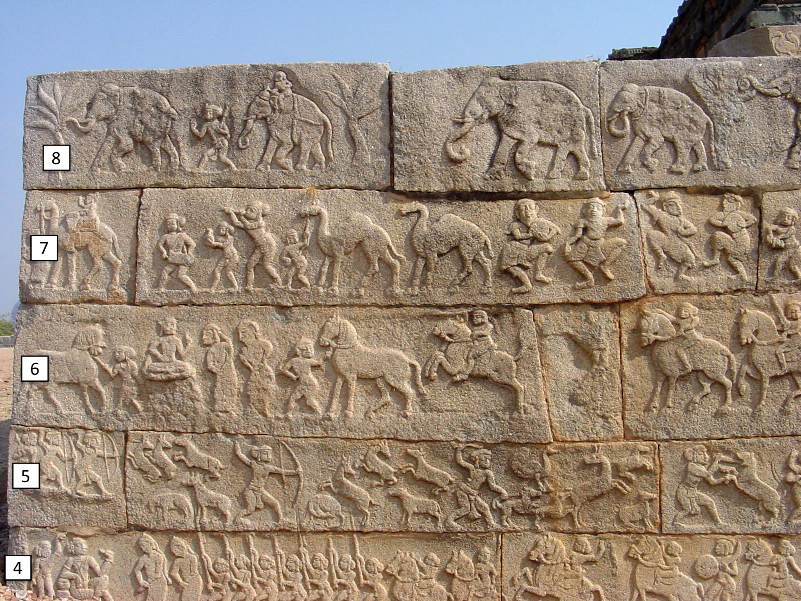 Mahanabami Dibba - detail of lower frieze carved stone wall showing many animals and people
