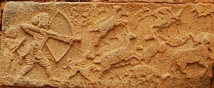 Mahanavami Dibba - detail royal hunter stone carving of person hunting with bow