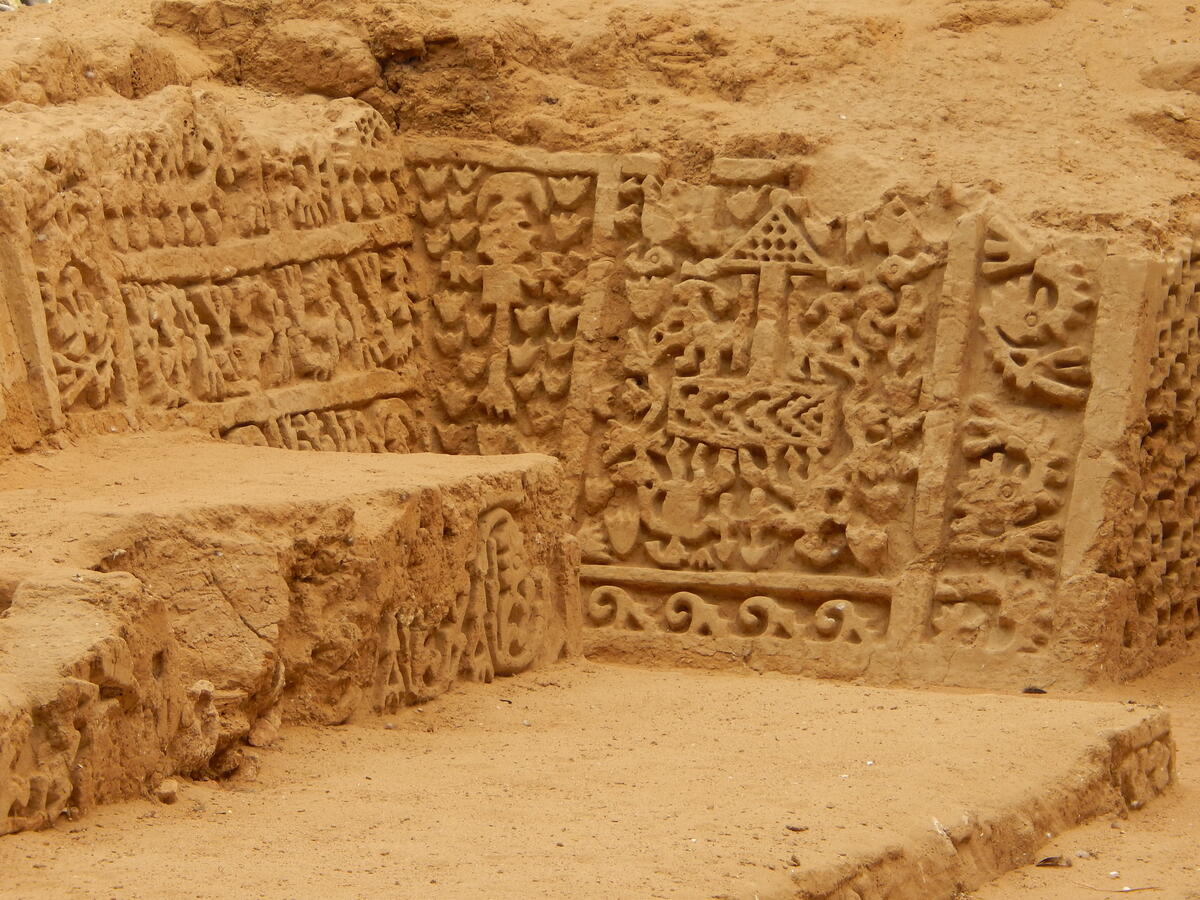 part of decorated ceramic or mud wall with all figures shown in profile