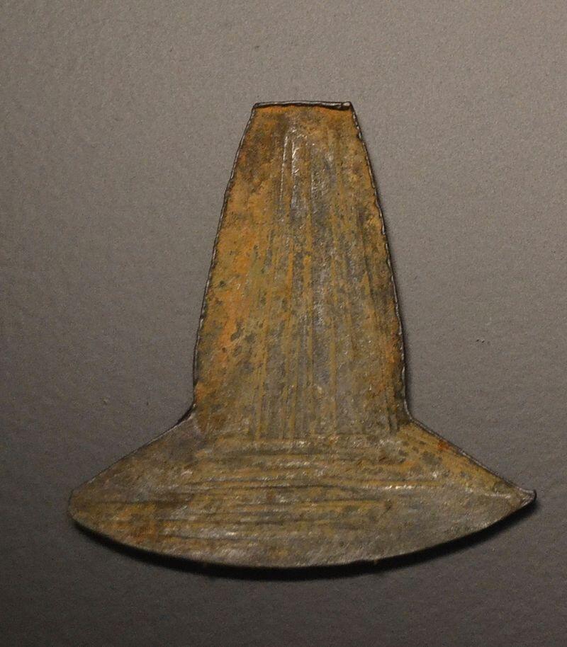 flat axe-shaped piece of metal