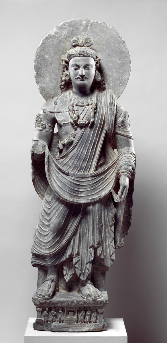 Standing Bodhisattva Maitreya sculpture of man with halo