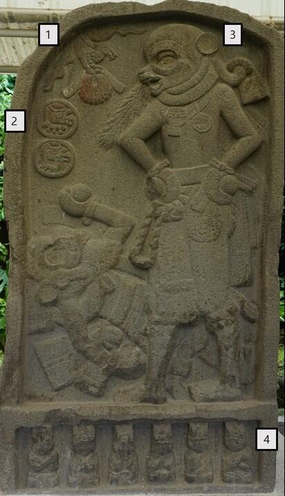 bas-relief stone carving, standing figure with hands on hips, second figure on the ground