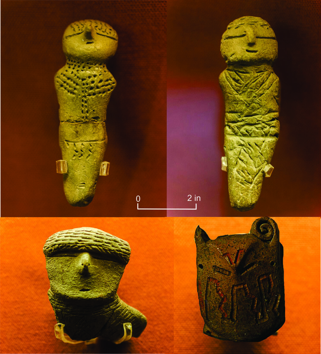four ceramic figurines, eyes horizontal slits, pointed noses, embossed designs