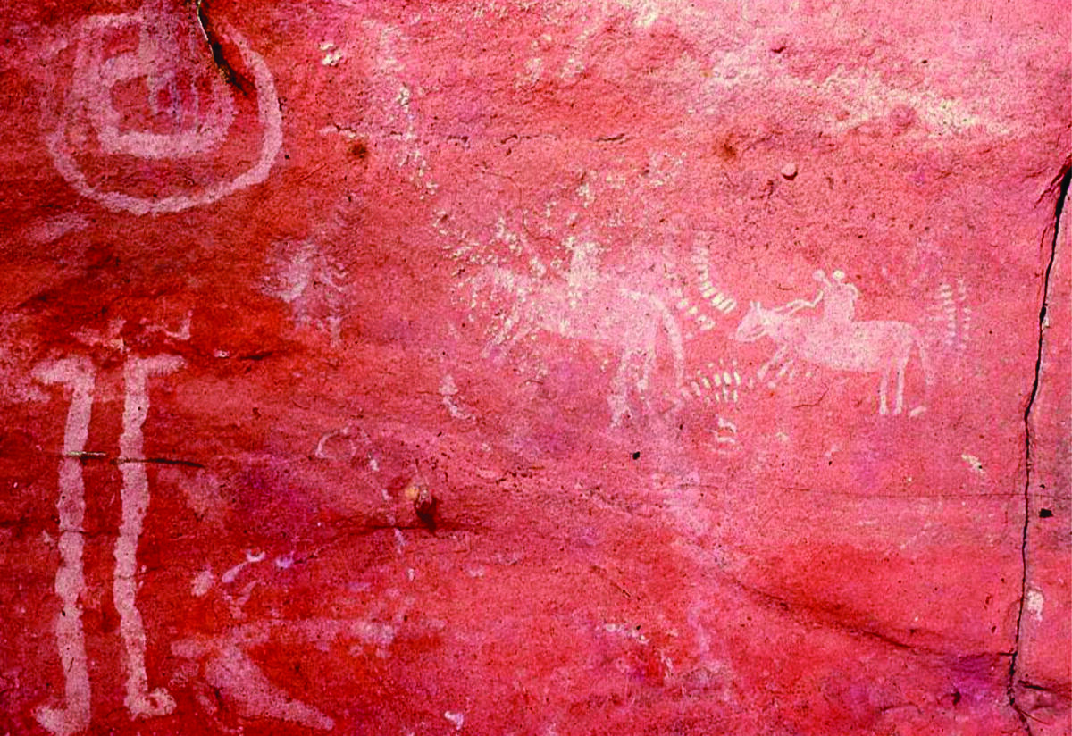 painting of two figures on horseback, inscribed on the inside of a cave