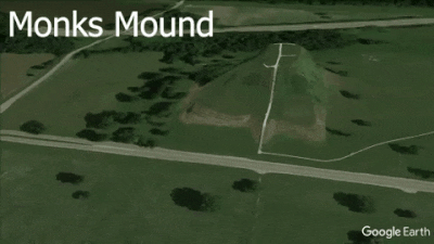 flyover of monks-mound, grass and trees, with large rectangular hill and smaller round hills