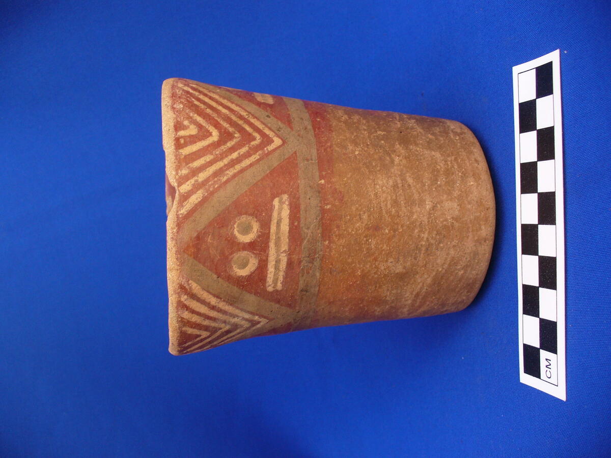 round ceramic vessel, reddish brown with geometric designs